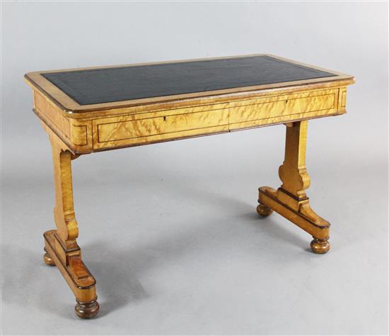 An early Victorian birds-eye maple writing table, by Holland & Sons, W.3ft 6in. D.2ft H.2ft 5in.